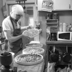 Re-assembling the pepper-filled dehydrator.
