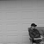 Uniform, chair, garage door.