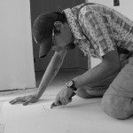 Cutting holes in drywall.