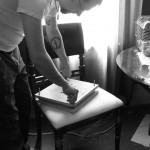 Tightening the book press.