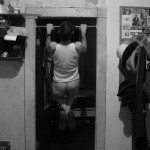 Doing chin-ups.