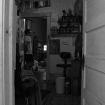 Standing in the other doorway.
