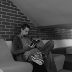 Reading under the stairs at school.