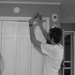 Fanning the smoke alarm to try and shut it up.
