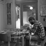 Stamping postcards.