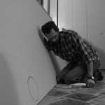 Cutting drywall.